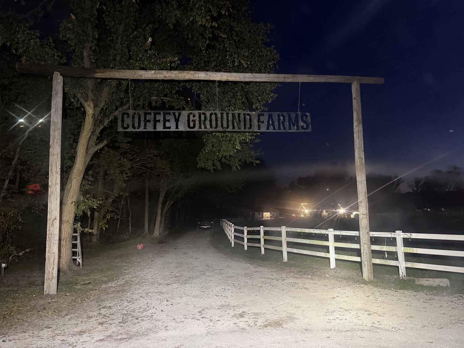 Custom Coffey Ground Farms steel sign at a ranch entry