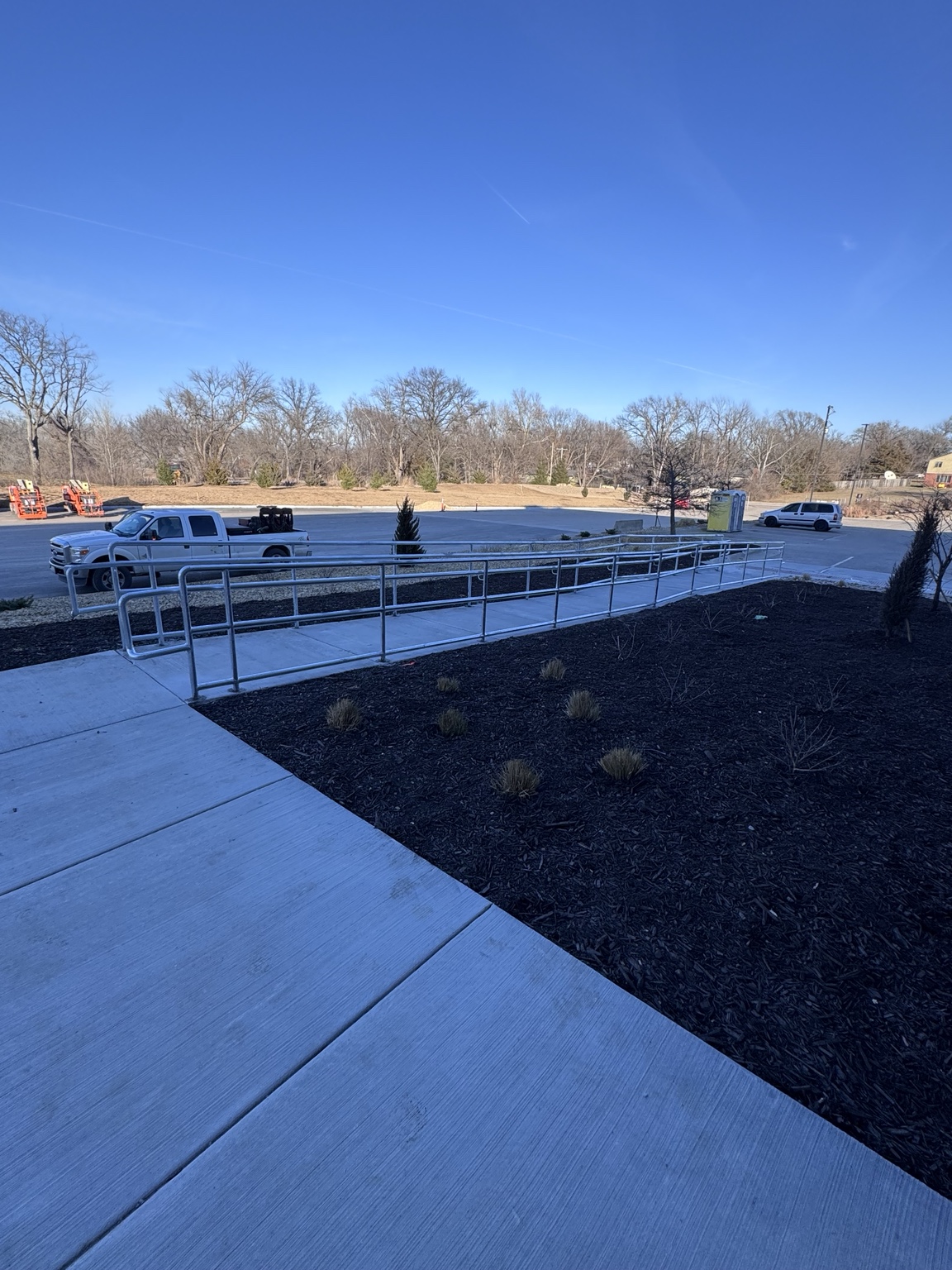 Exterior pipe handrails fabricated for a concrete access ramp